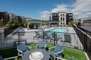 outdoor pool area with chaise lounge chairs