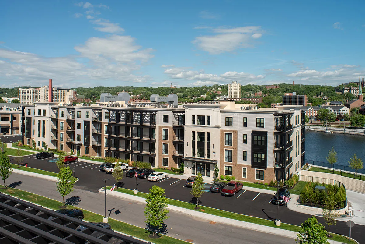 view of 4 story apartment building with balconies