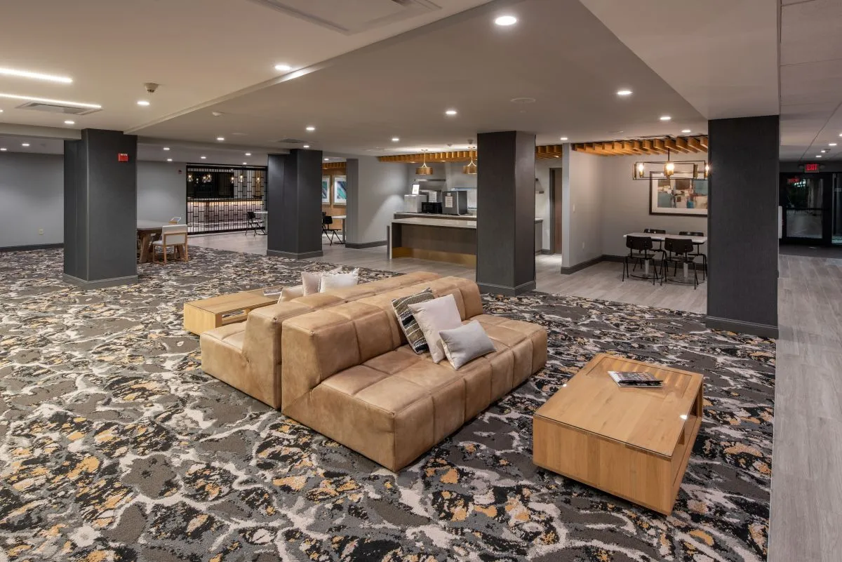 Hotel Trilogy patterned carpet with common area seating