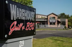 Warehouse Grill and BBQ front sign and parking lot