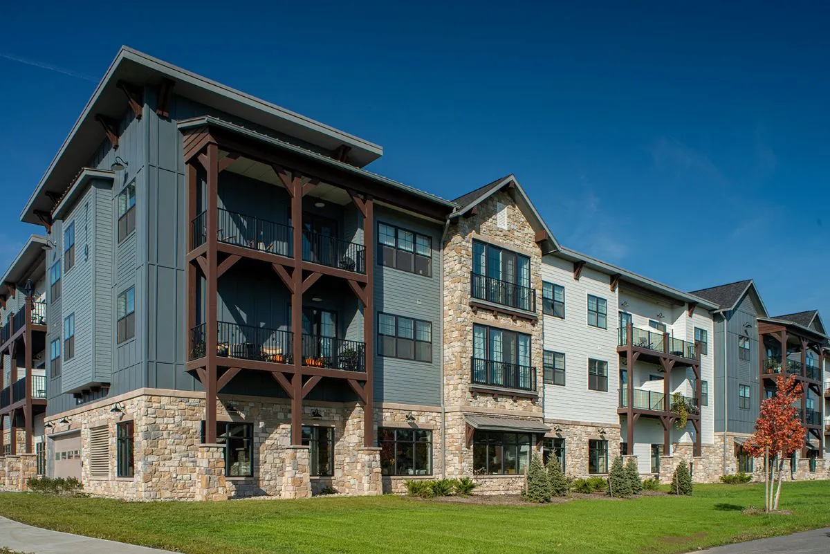 Fowler Square Apartment stone and blue siding exterior