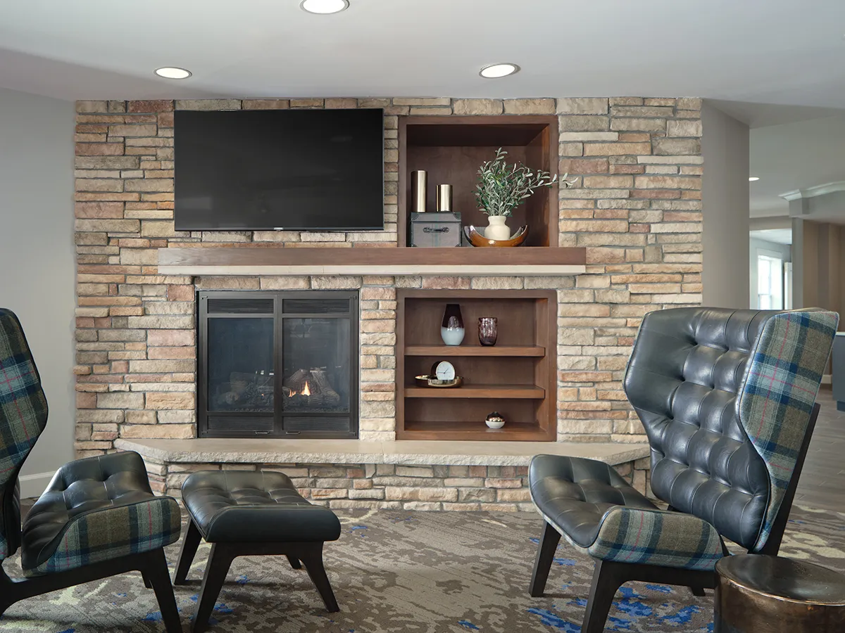 Lounge area with fireplace and TV