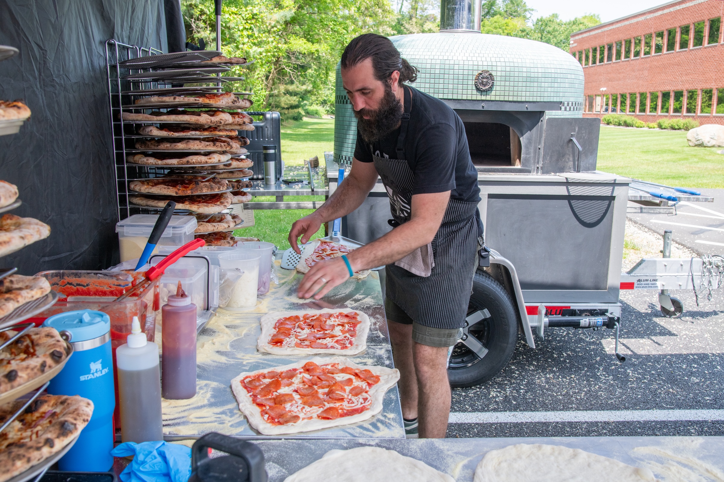 man making pizza